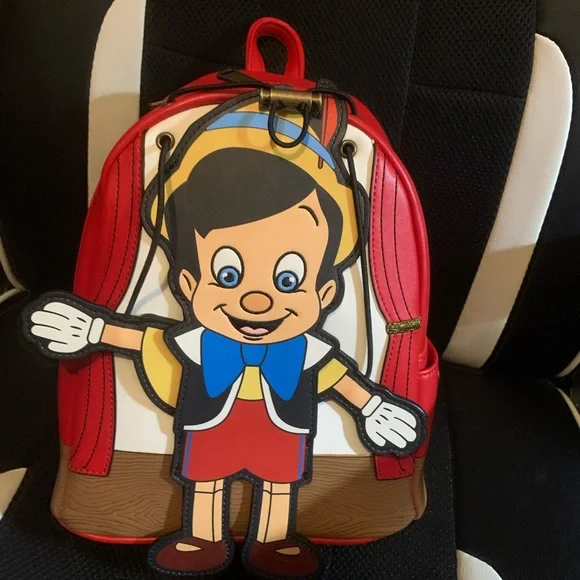 Pinocchio loungefly backpack with moving arms and matching loungefly wallet - Picture 2 of 16